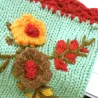 Knitted winter gloves - half-finger design - with a flowery embroideryGloves