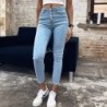 Skinny jeansy z wysokim stanem - z guzikami z przodu - elastyczneSpodnie