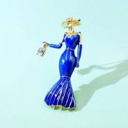 Fashionable brooch - a woman in a blue dress with a crystal handbagBrooches
