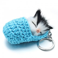 Sleeping cat in a hand-woven cot - keychain
