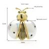 White / gold ladybug broochBrooches